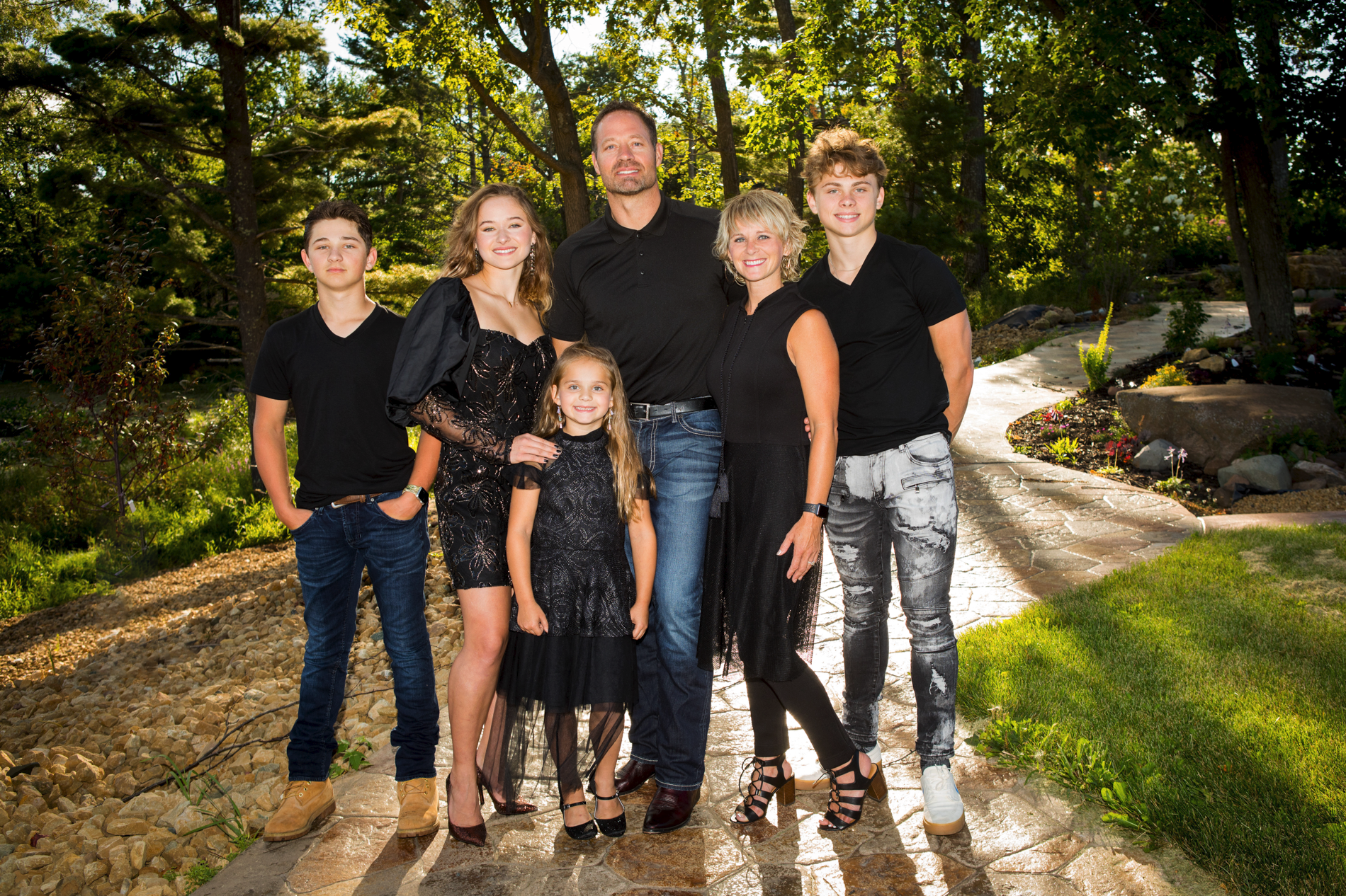Family photographed at their home in Turtle Lake, WI wearing black coordinated clothing by seasons potography.