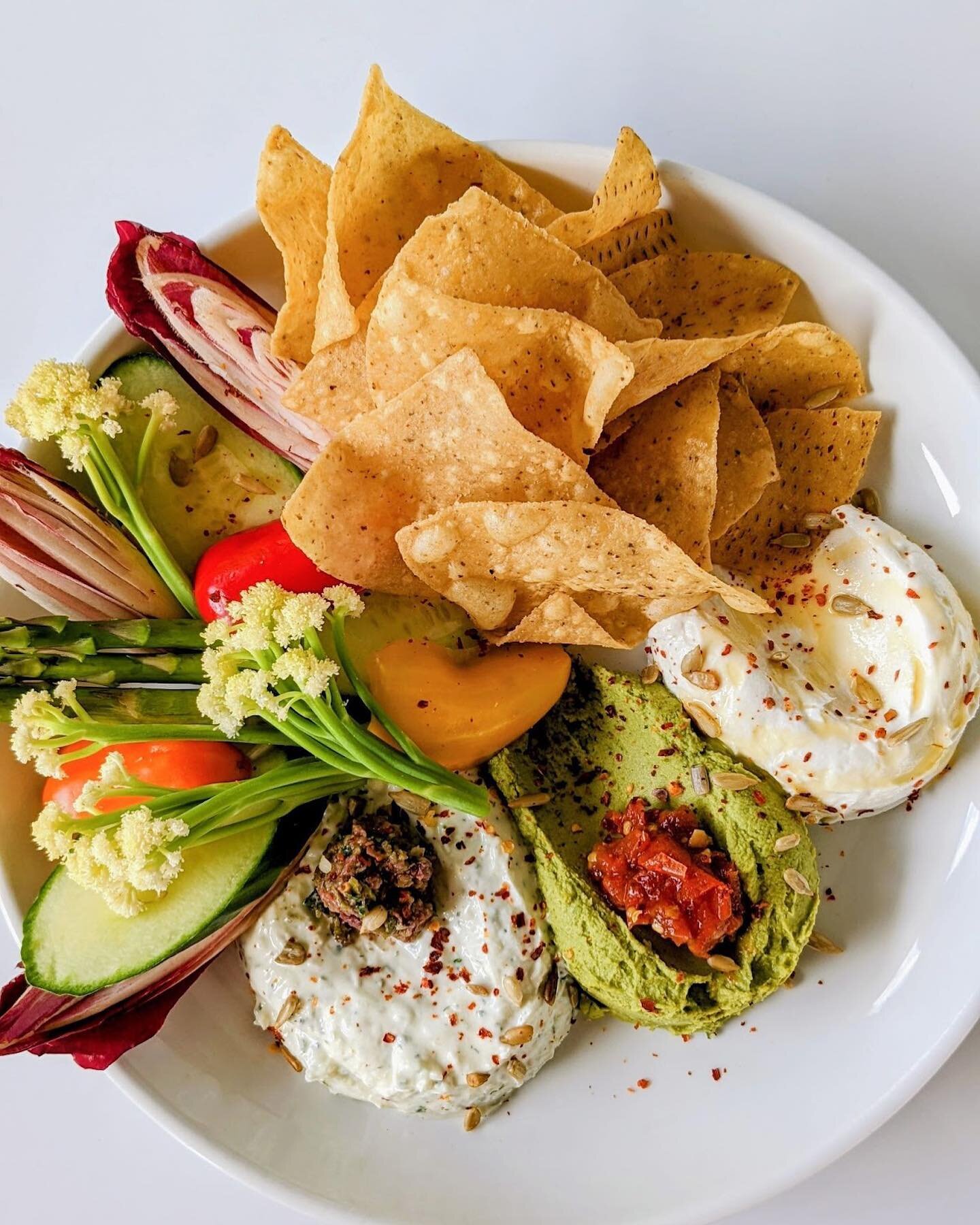 Our Mediterranean Dip Trio is the perfect appetizer to share ✨
Colorful crudit&eacute;s + #glutenfree tortilla chips are served with 3 of our favorite dips:
	&bull;	house-made pesto hummus
	&bull;	cool tzatziki with olive tapenade
	&bull;	creamy labn