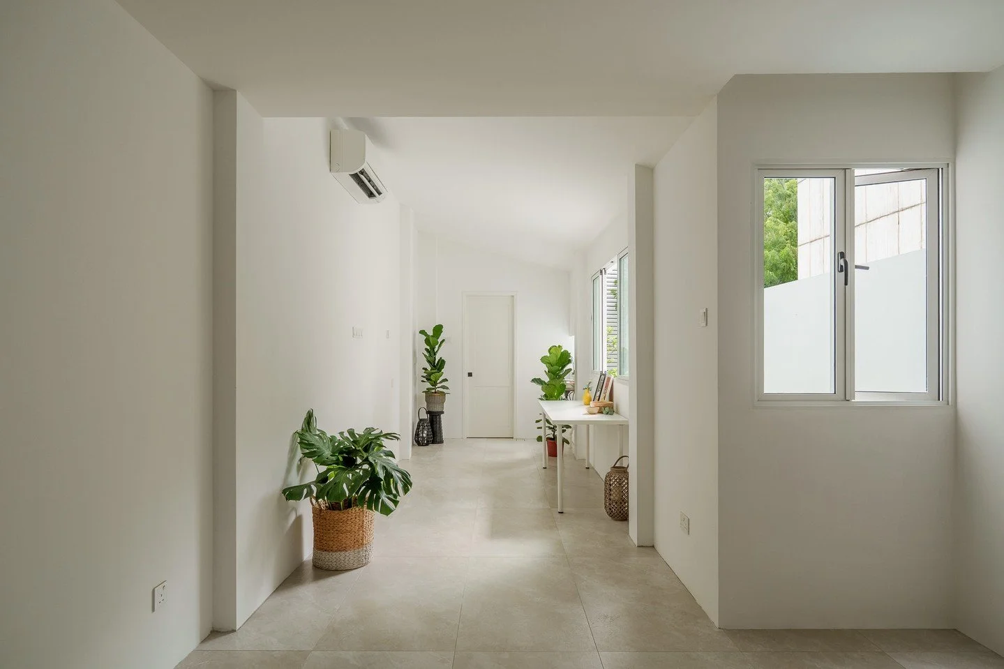 The rear co-living unit at the Bukit Timah Shophouse opens out towards the rear court, and offers views across the back alley overlooking a neighbourhood park - creating a pleasant  living environment for the otherwise undesirable compact spaces whic