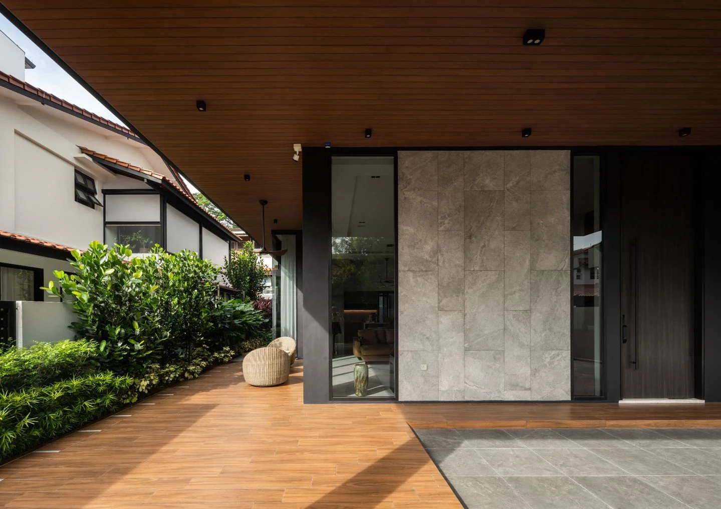 While optimizing the built-up area for Skyville to cater to multi-generational living, the architectural volume was broken up to feel like stacked villas elevated from the ground.

A tropical patio envelopes the communal ground level 'villa', which i