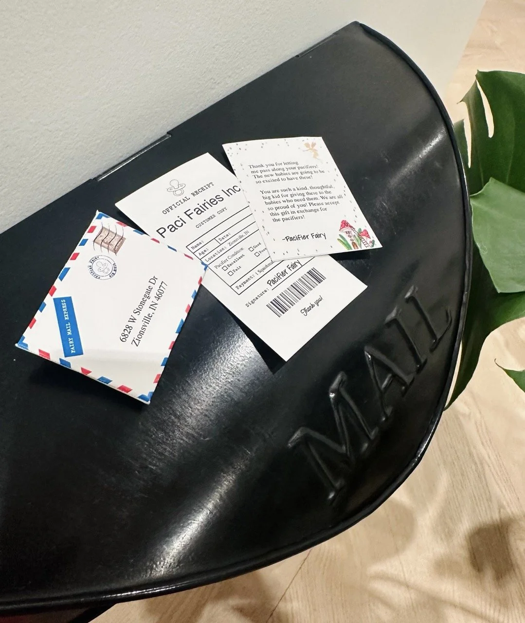 letters on top of black pacifier fairy mailbox