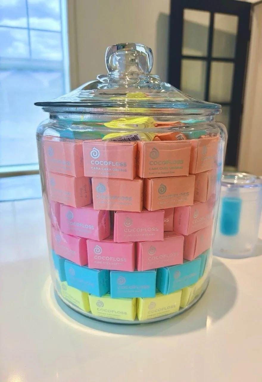 cocofloss packages in glass jar