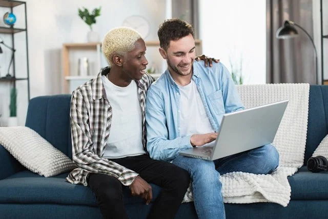 gay couple doing online lgbtq couples therapy