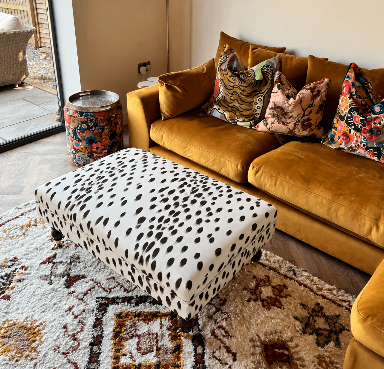 Ivory dalmatian-spotted coffee table footstool.png