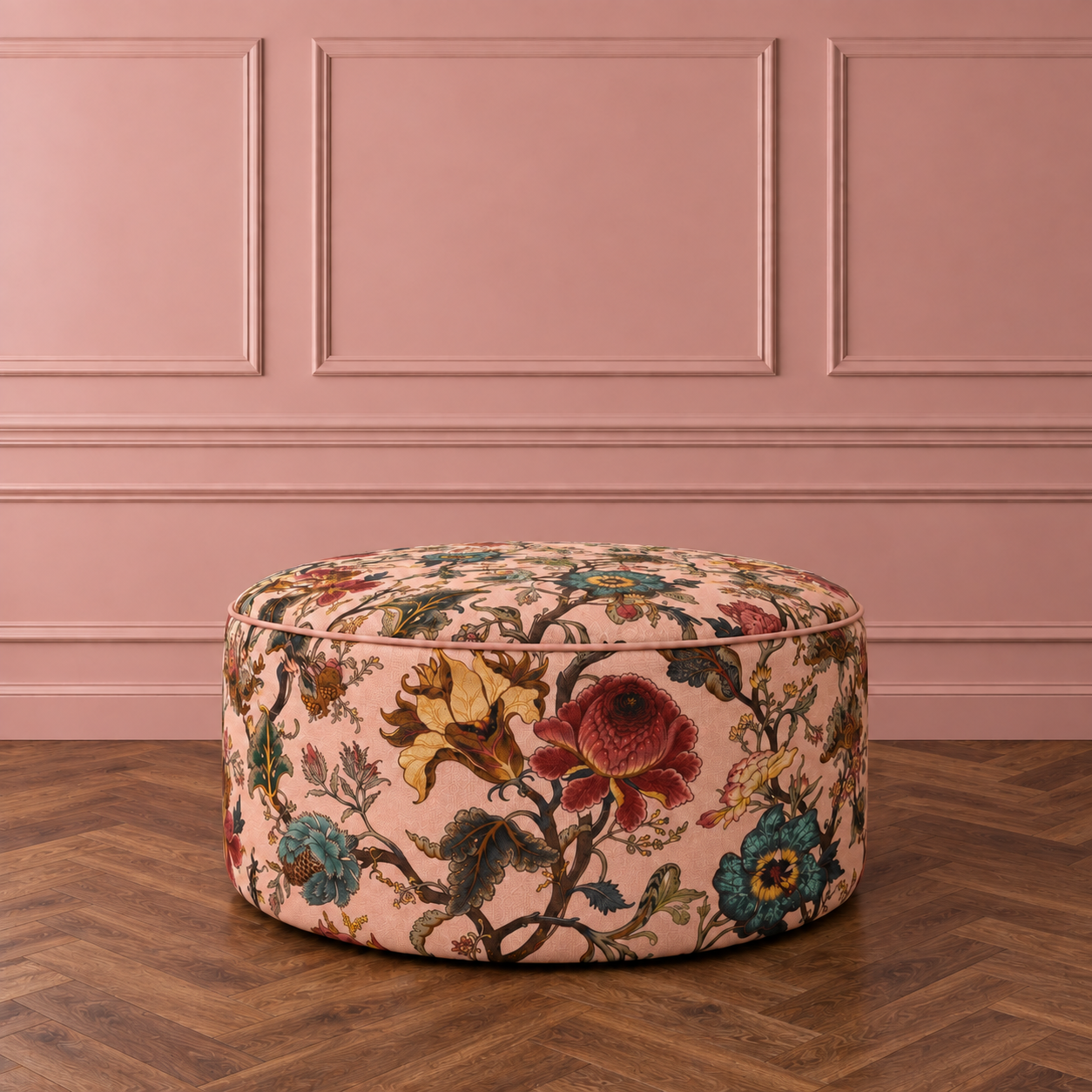 Blush pouffe on walnut herringbone flooring.png