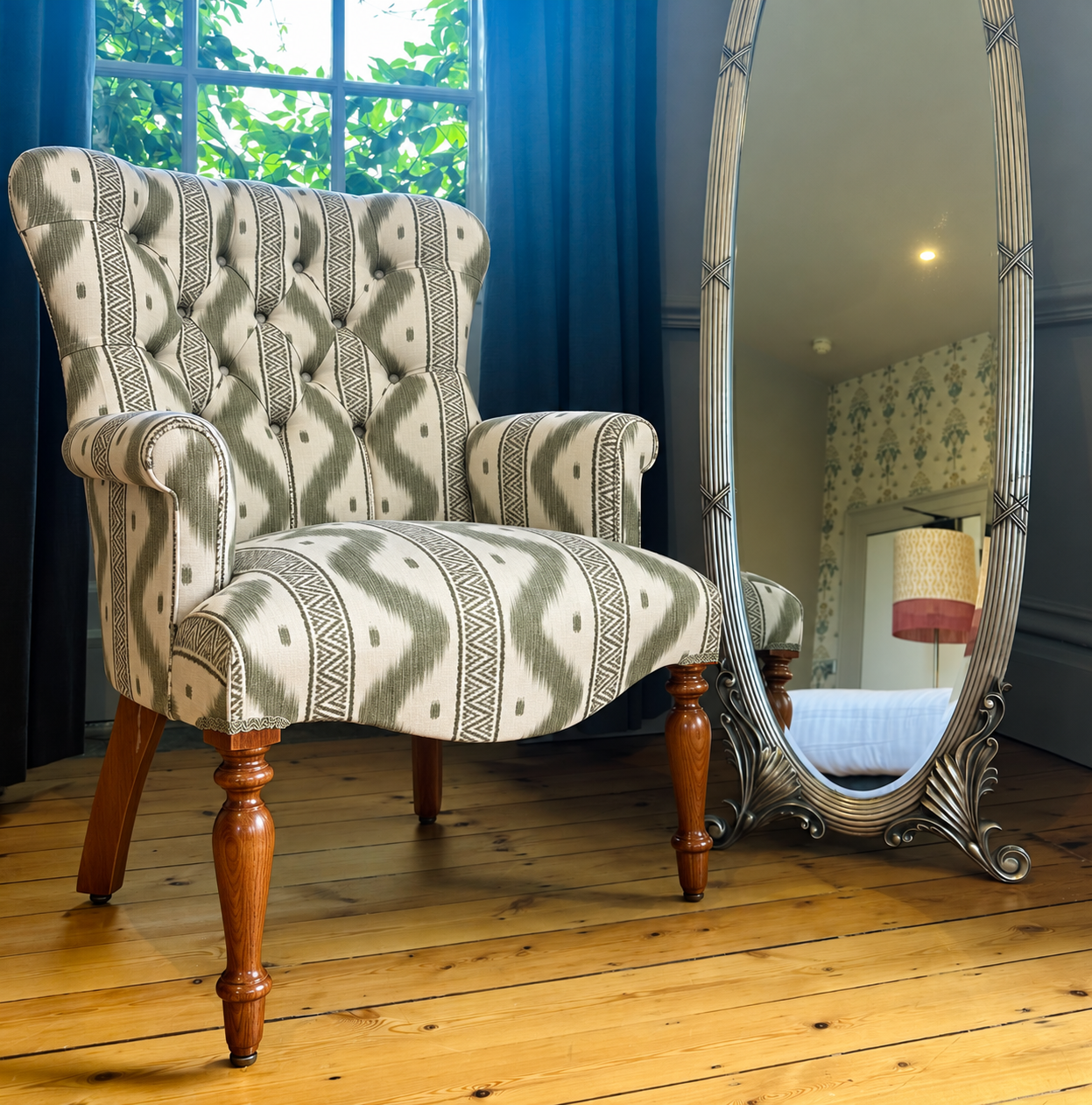 Green ikat wingback chair by mirror.png