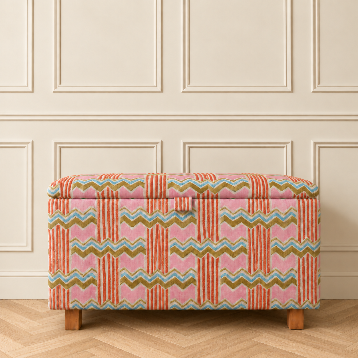 Patterned ottoman on oak herringbone floor.png
