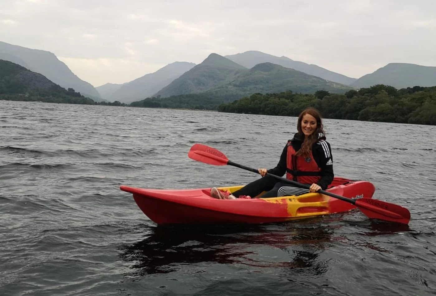 Woman kayaking on Lake Padarn