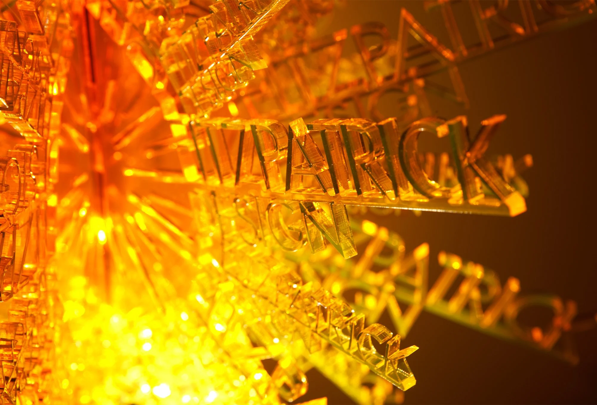 Fitzpatrick Design logo made out of glow-edge orange perspex
