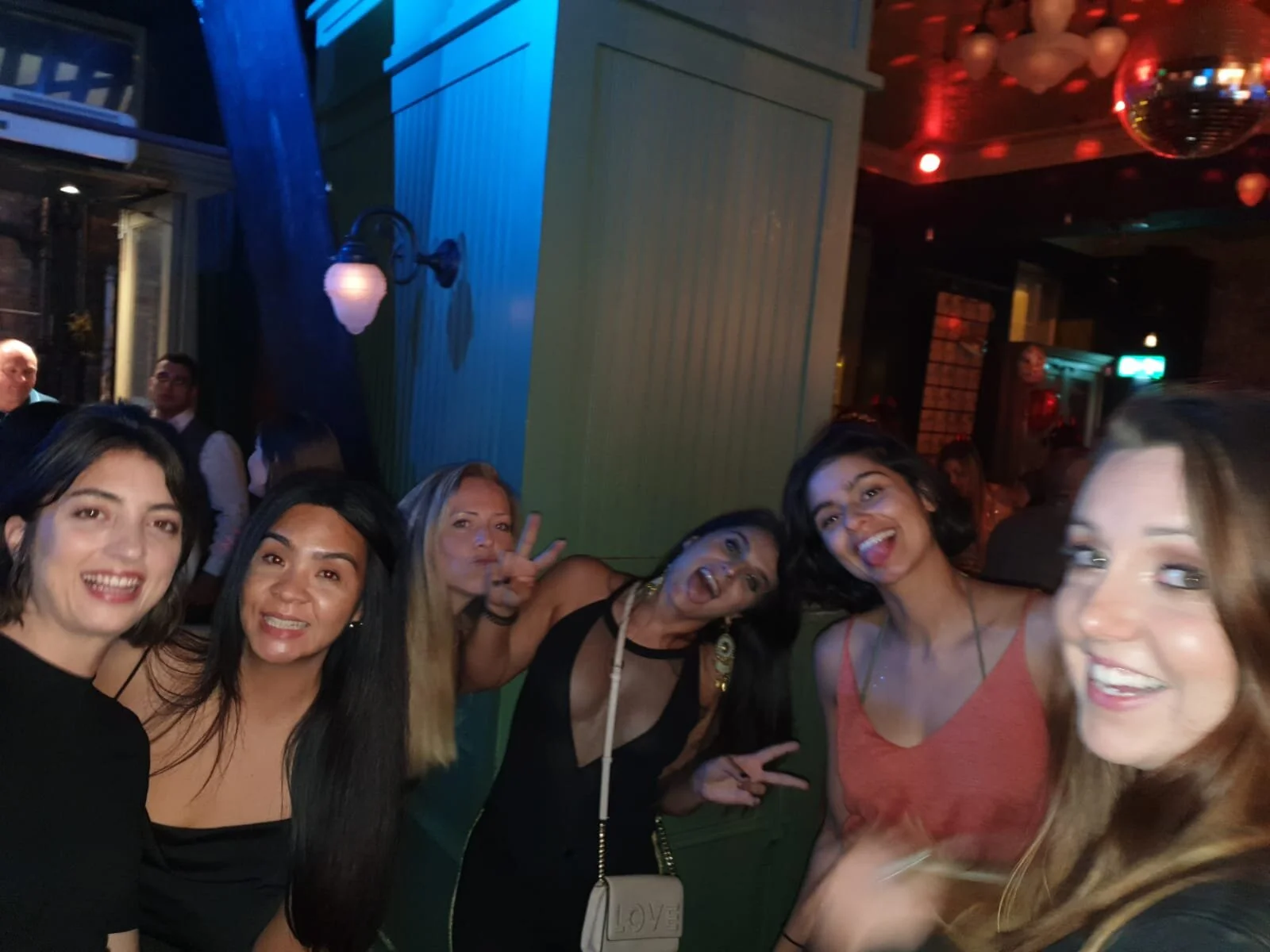 Inglis Netball club members post for a photo on a social night out