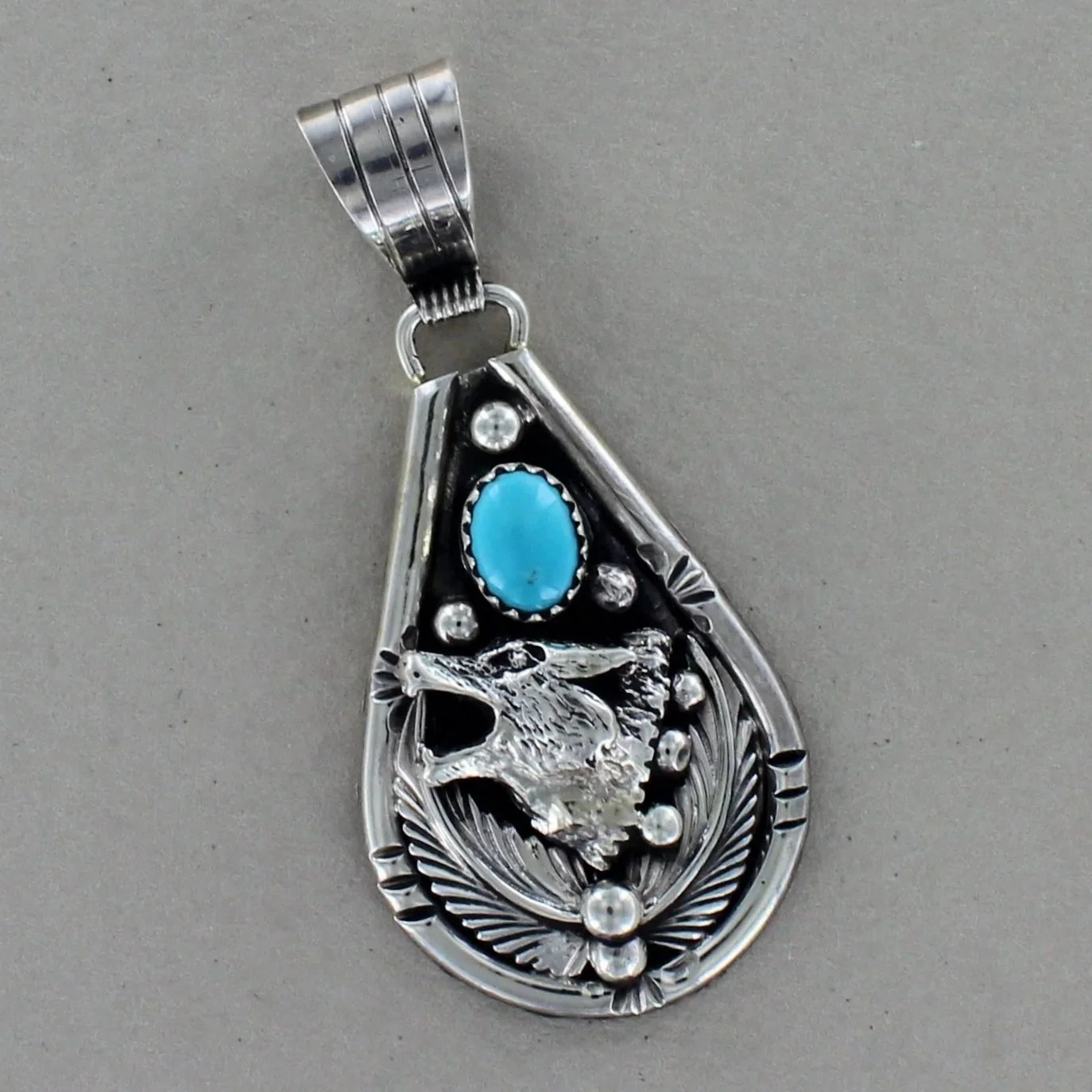 Teardrop Silver Turquoise Wolf Pendant by Henry Attakai
