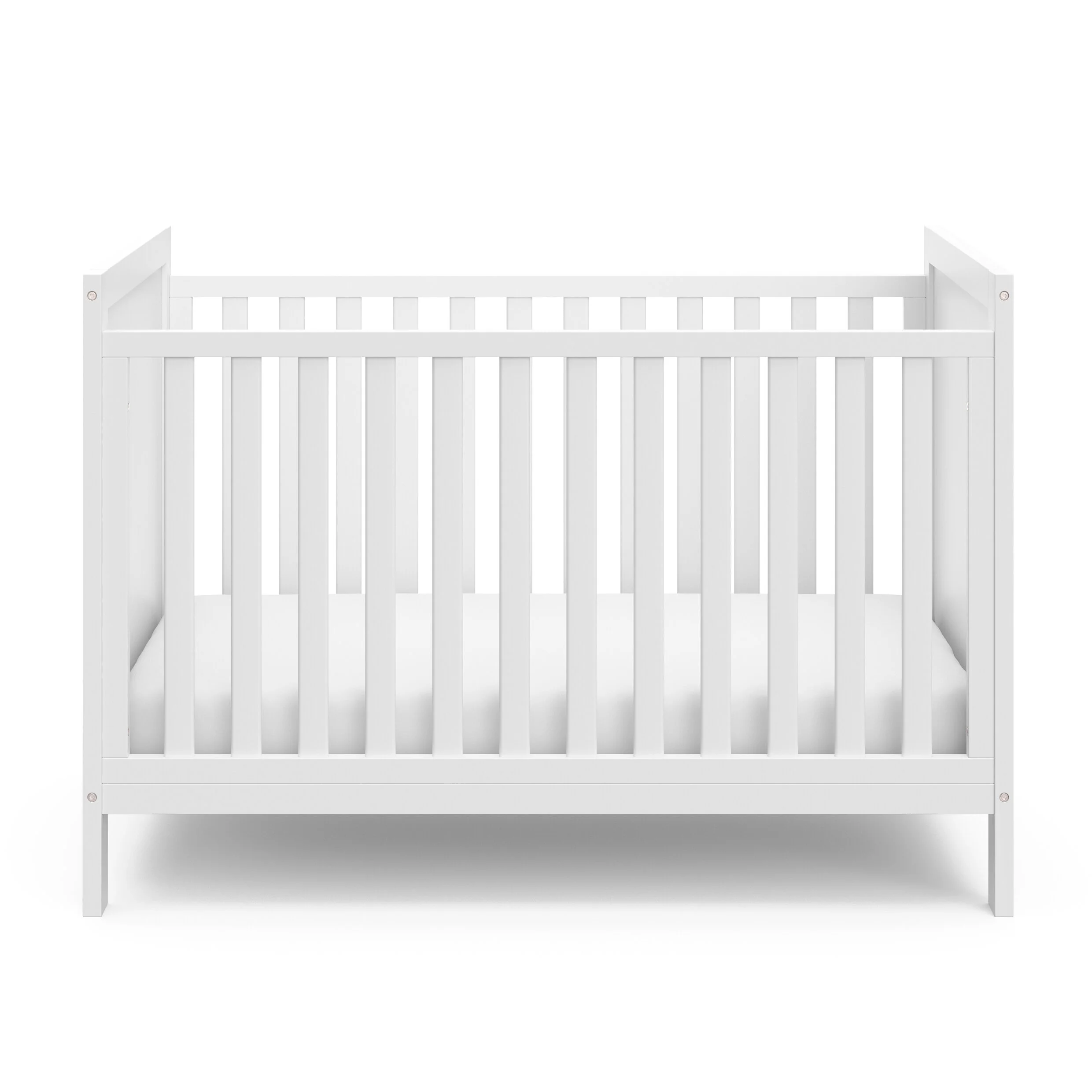 white cot and mattress