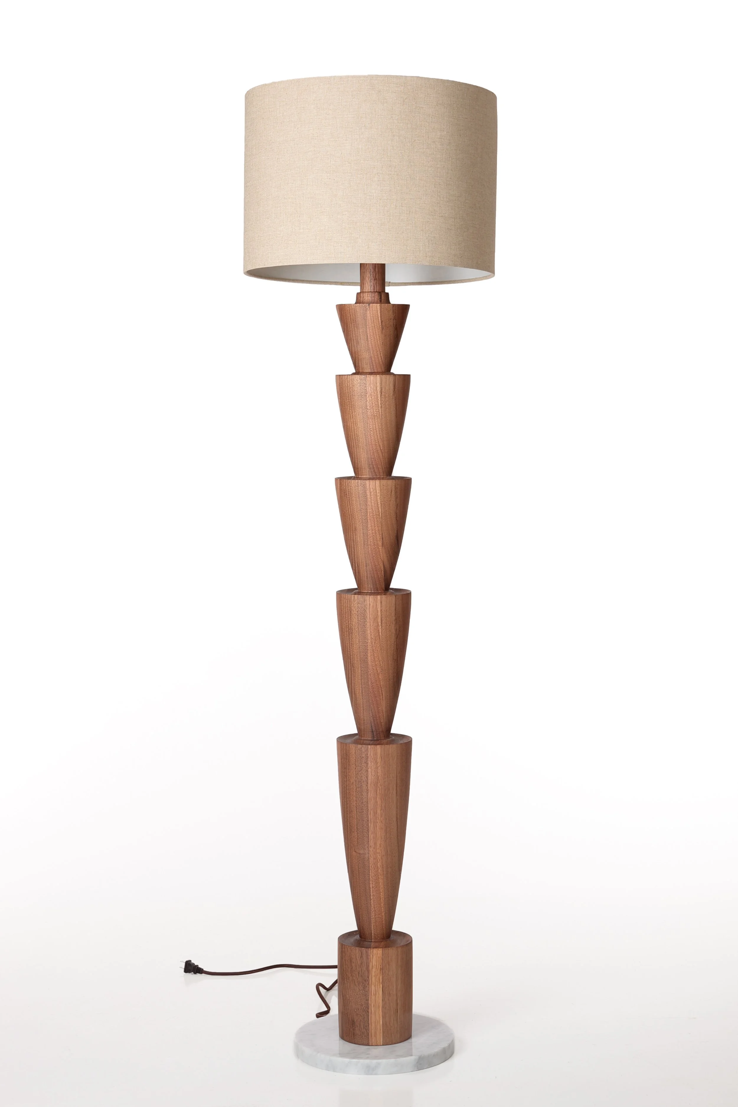 Wooden standing floor lamp with a beige fabric lampshade and a marble base.