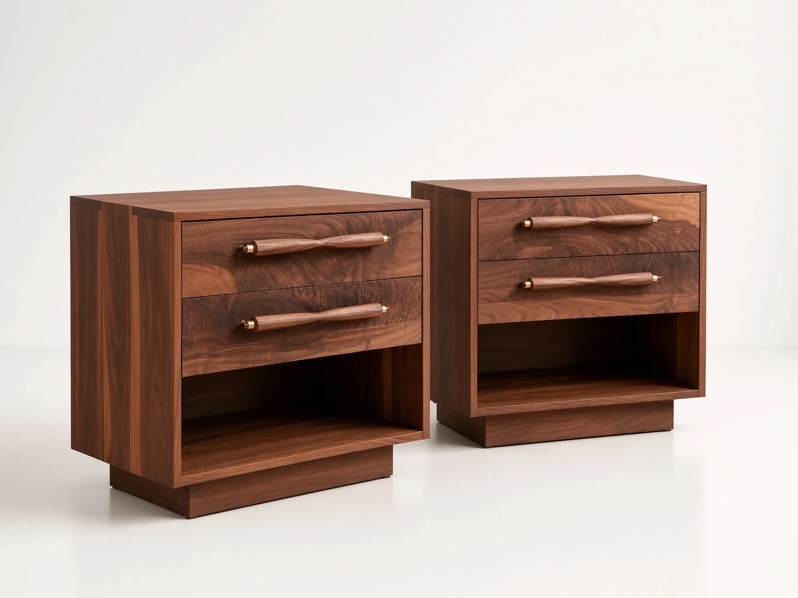 Two handmade wooden nightstands with two drawers each and a lower open storage space, featuring handmade curved handles designed by Wooden Objex.