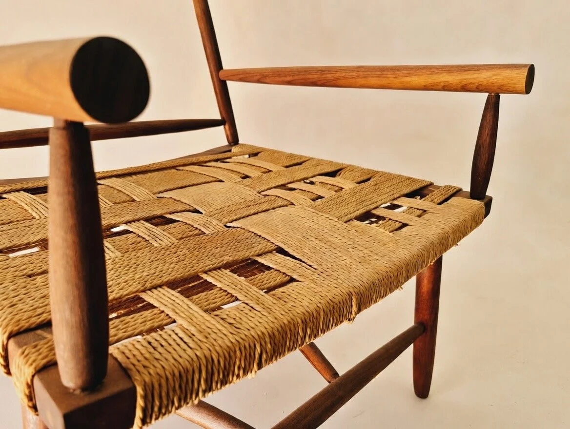 Wooden Objex walnut chair with rope seat.