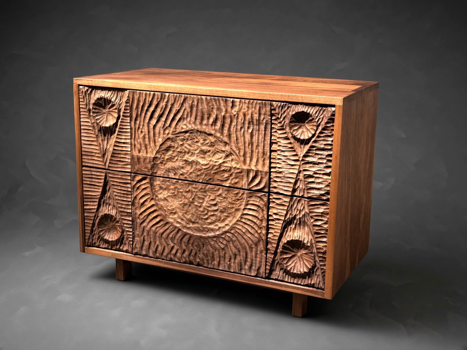 Wooden cabinet with hand carved, geometric patterns on the doors. Made by Wooden Objex. 