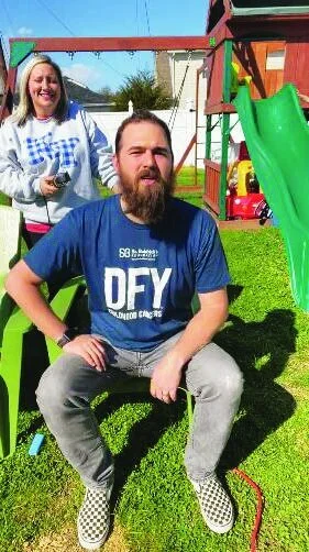 Teacher shaves hair, beard to raise money for group