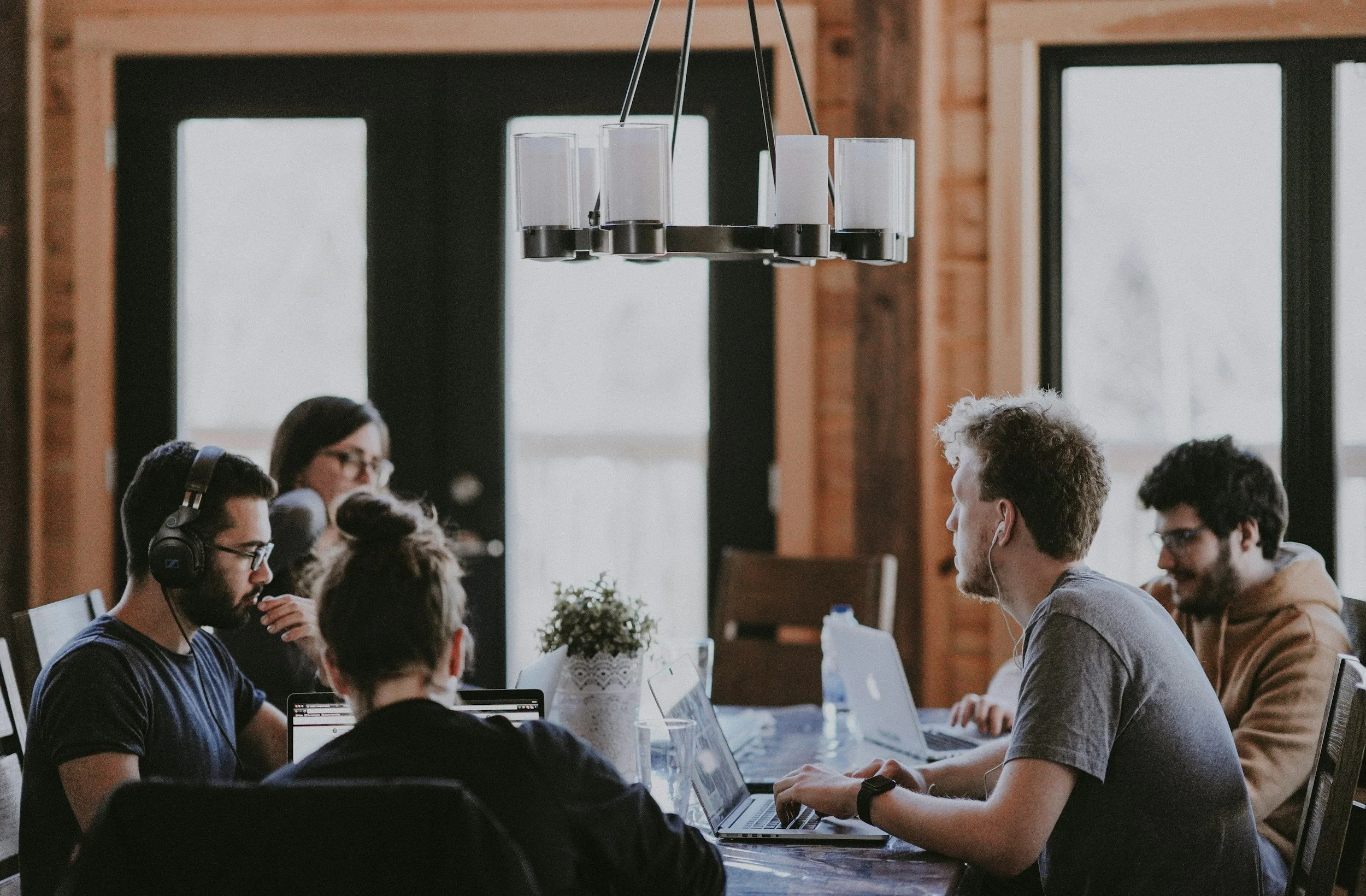 group of adults sitting at a conference table