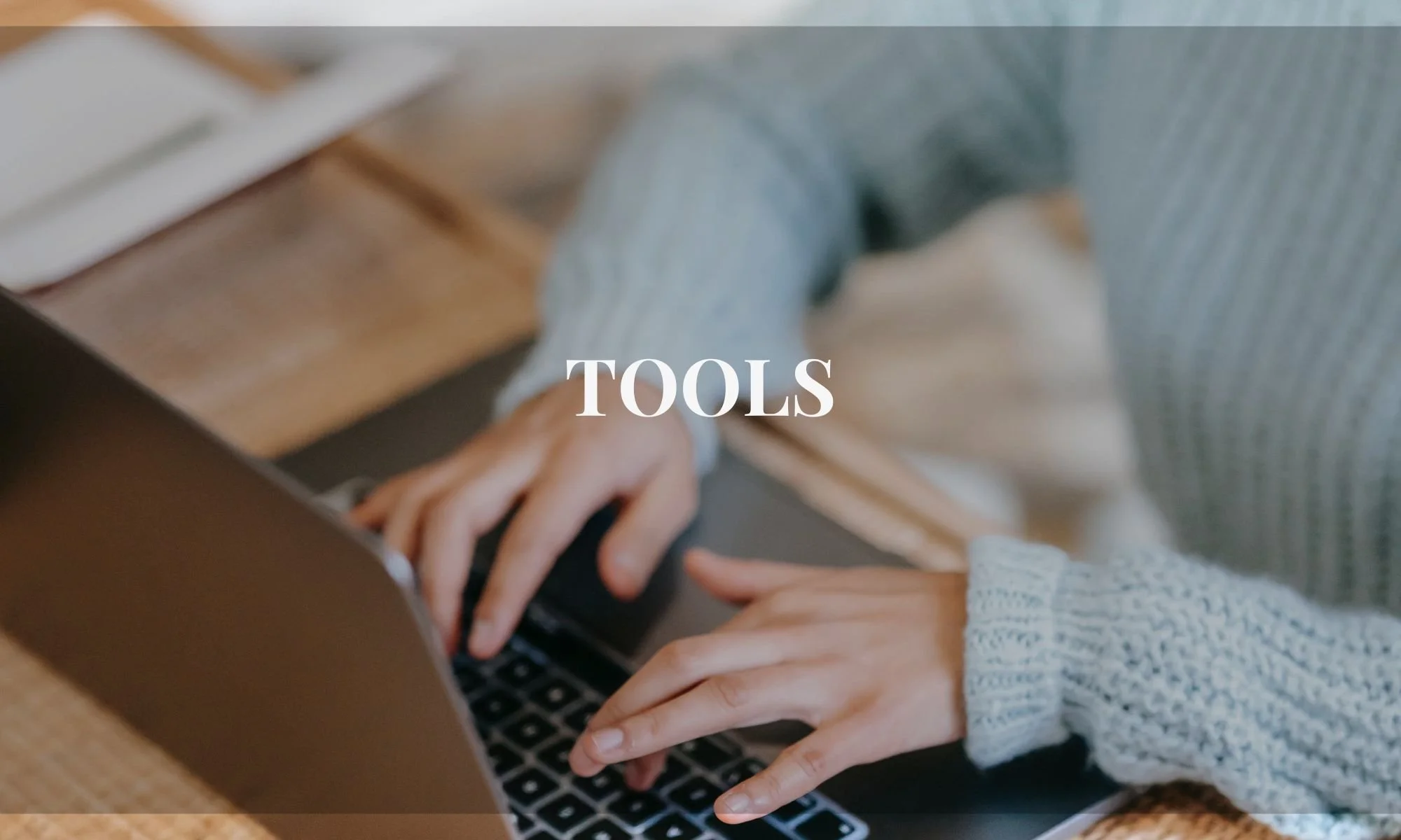 woman's hands typing on computer