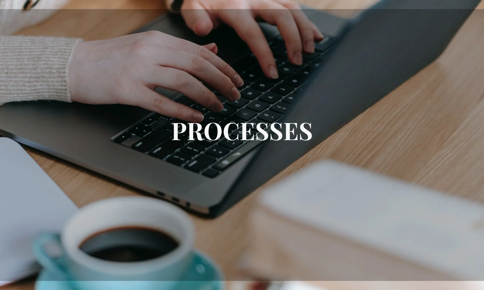 woman's hands tying on computer