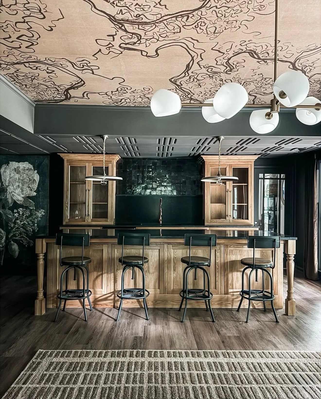 We&rsquo;d love to avoid the winter weather from this @eanesinteriors moody, speakeasy space with black honed granite. Who else agrees? ❄️✨🕯️

Happy Friday!! 🥂 

Designer/photos: @eanesinteriors 👏🏻👏🏻👏🏻 
Light Fixture: @shadesoflight 
Ceiling 