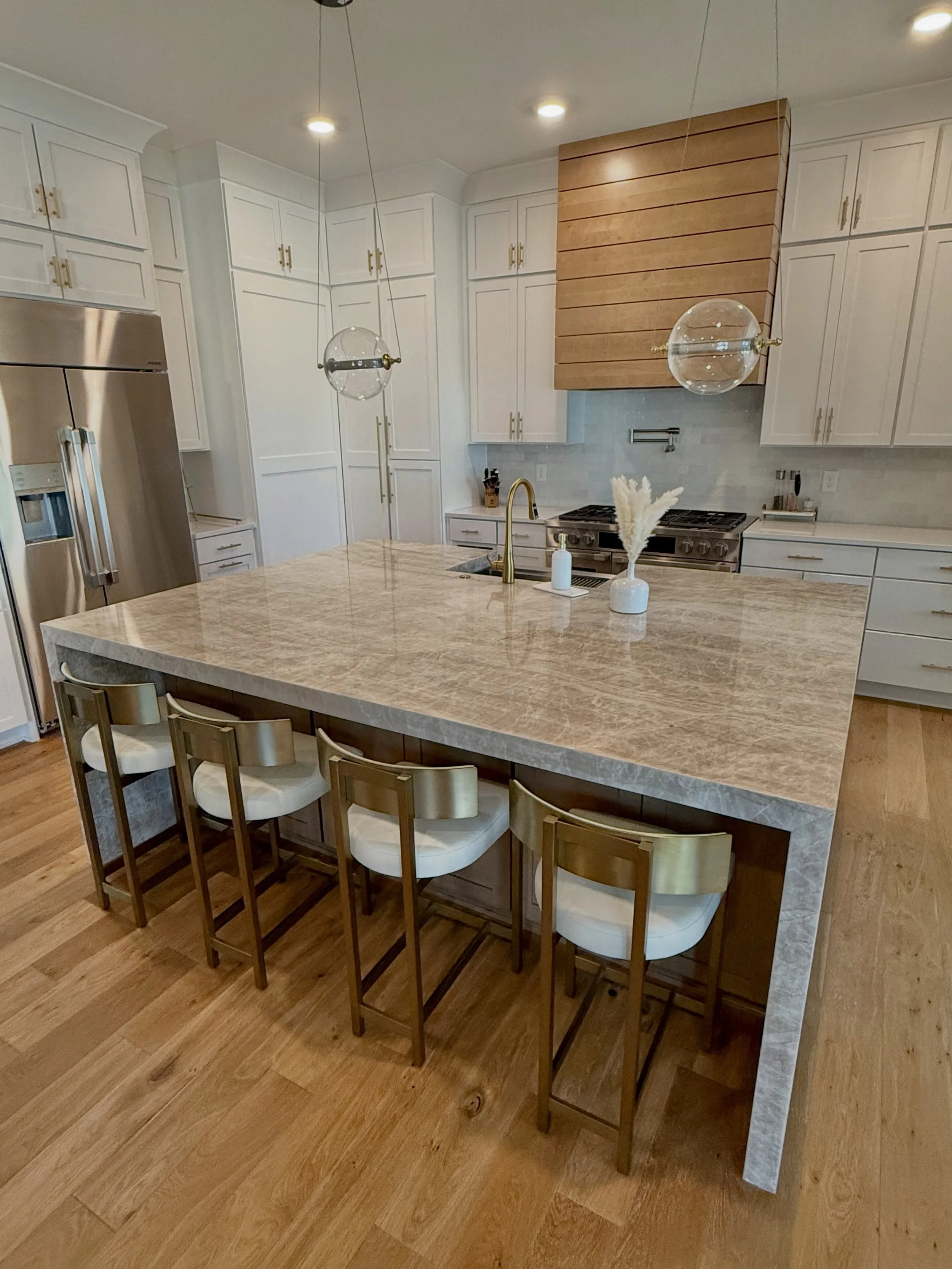 A beautiful Taj Mahal quartzite kitchen island featuring a waterfall edge on both sides - to maximize the use of the stone, so the homeowner can enjoy its beauty from every angle! ✨

_____

Providing custom countertops to Greater Atlanta + North Geor