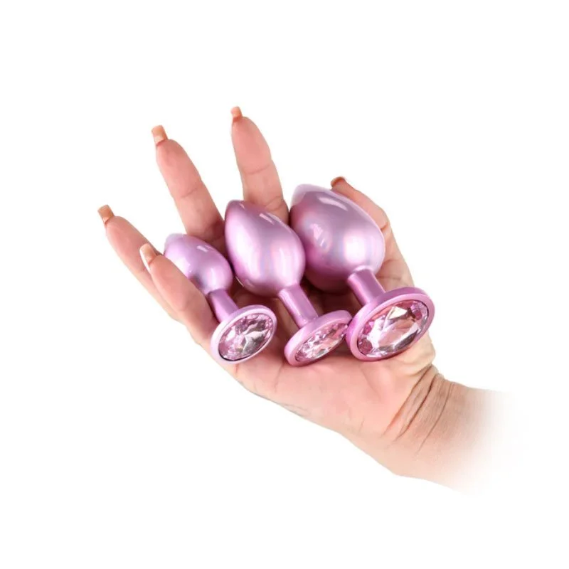 NSN-Rear-Assets-3pc-Metal-Plug-Kit-Pink-hand.jpg