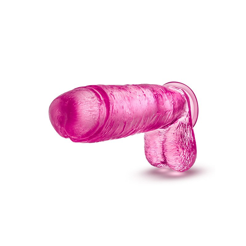 Pink realistic dong with balls and suction cup, dong is pointed forward/side.