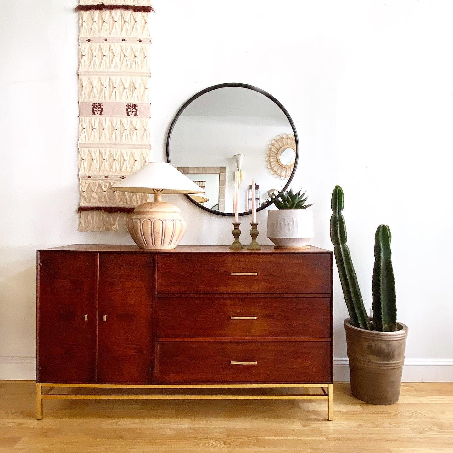 A great small scale credenza. Walnut inlay details and brass hardware. SOLD
56&rdquo; long x 19&rdquo; deep x 32.5&rdquo; tall

Black Round Mirror SOLD
Table Lamp $125
Weaving SOLD