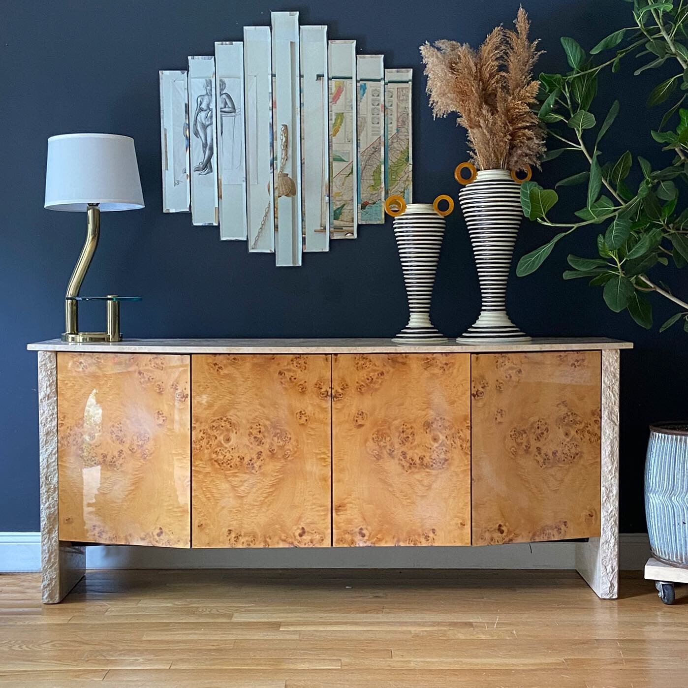 Some seriously sexy materials. Burl and travertine credenza $3200 79&rdquo; long x 22&rdquo; deep x 34&rdquo; tall

Paneled Mirror $325 36&rdquo; x 36&rdquo;
Vases SOLD
Brass &amp; Glass Table Lamp $245