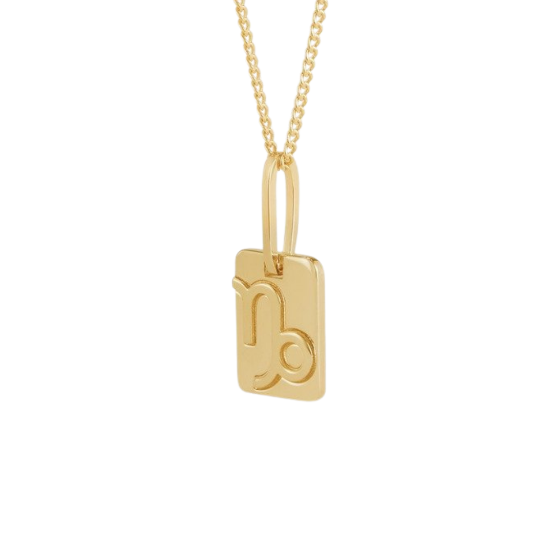 Celine Astrologie “Capricorn” necklace in brass with gold finish, $520 at Celine