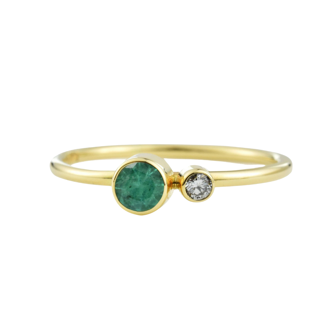 Valerie Madison “Kiss” ring in 14k yellow gold with emerald and diamond, $400 at Valerie Madison