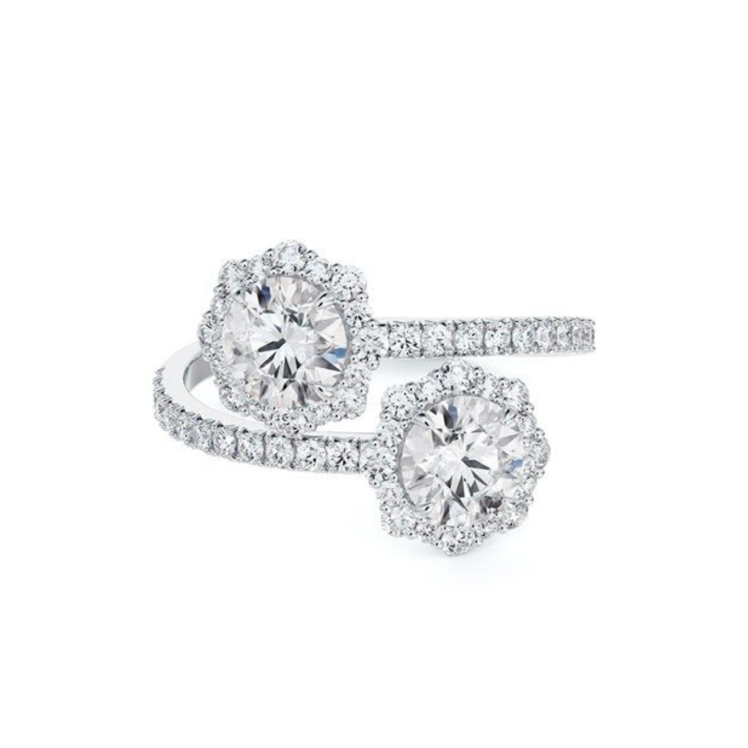 De Beers Jewelers “Center of My Universe” floral halo two-stone ring with diamonds, starting at $3,975 at De Beers Jewelers