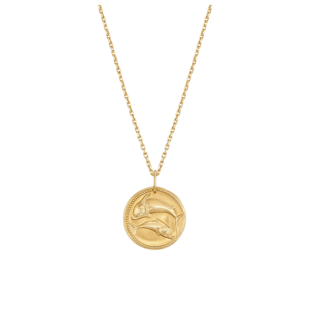Van Cleef &amp; Arpels “Zodiac medal Piscium” in yellow gold, $2,310 at Van Cleef &amp; Arpels