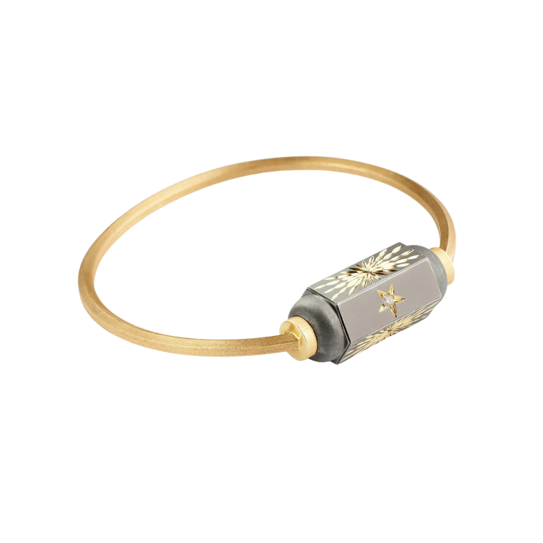 “Shining Star” bangle bracelet in yellow gold with rhodium finish, $3,111 