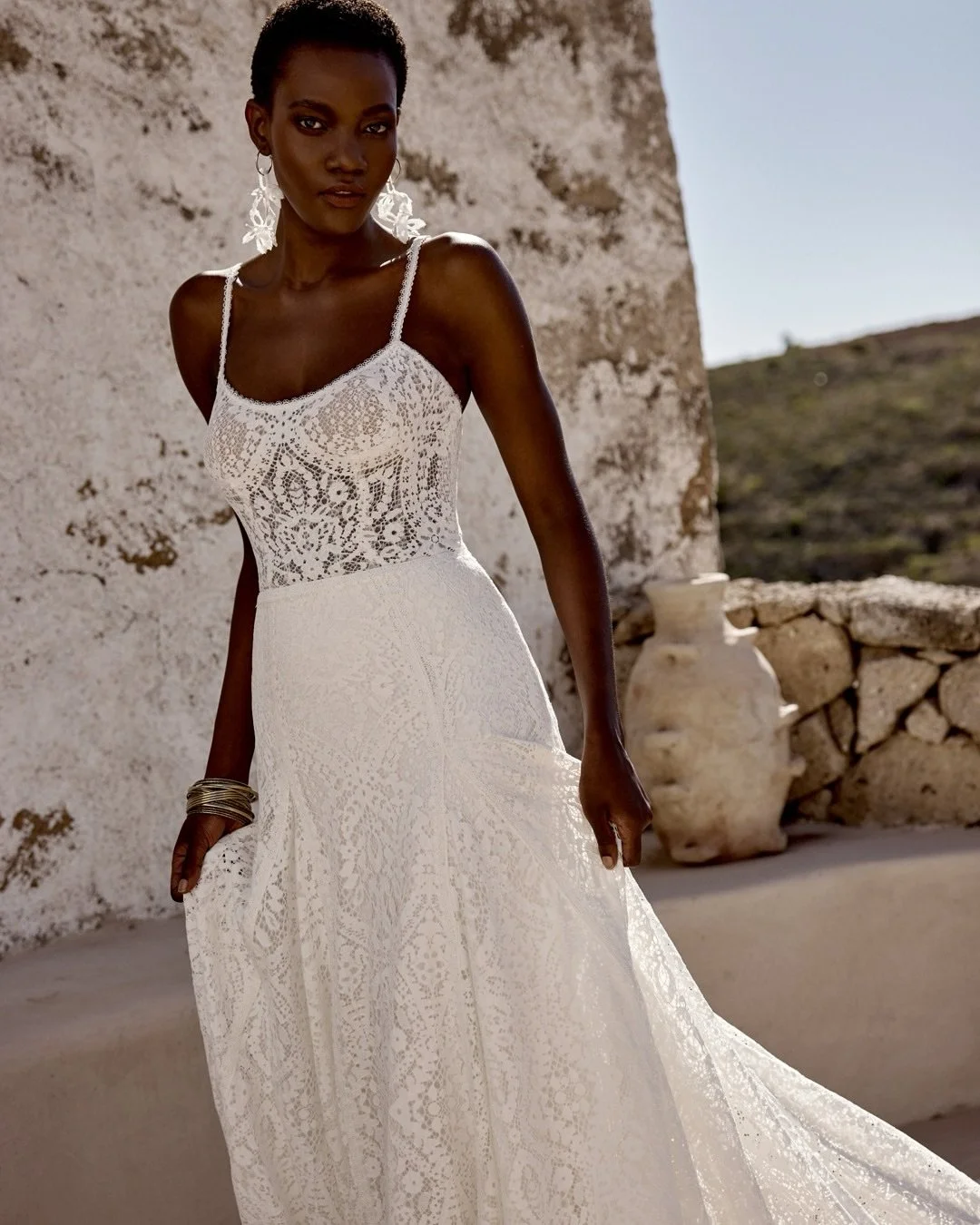 @bylillianwest #Style_66358 captivates with delicate lace trim, a sheer bodice, and flowing A-line silhouette for the romantic, free-spirited bride. 

#LillianBride #weddinginspiration #bohobride #elopementbride #alternativebride #bohoweddingdress #b