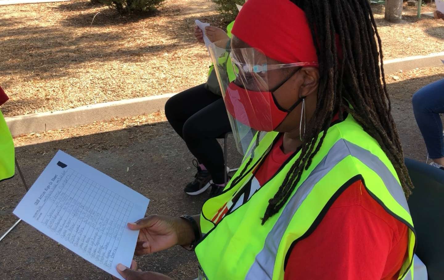 A UNITE HERE union member reviews a block walking list in Arizona.