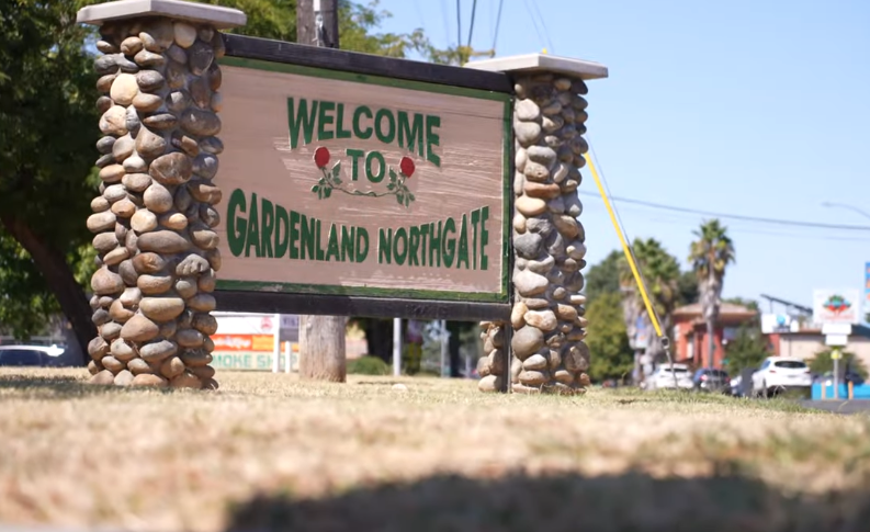 A road sign that says "Welcome to Gardenland Northgate"