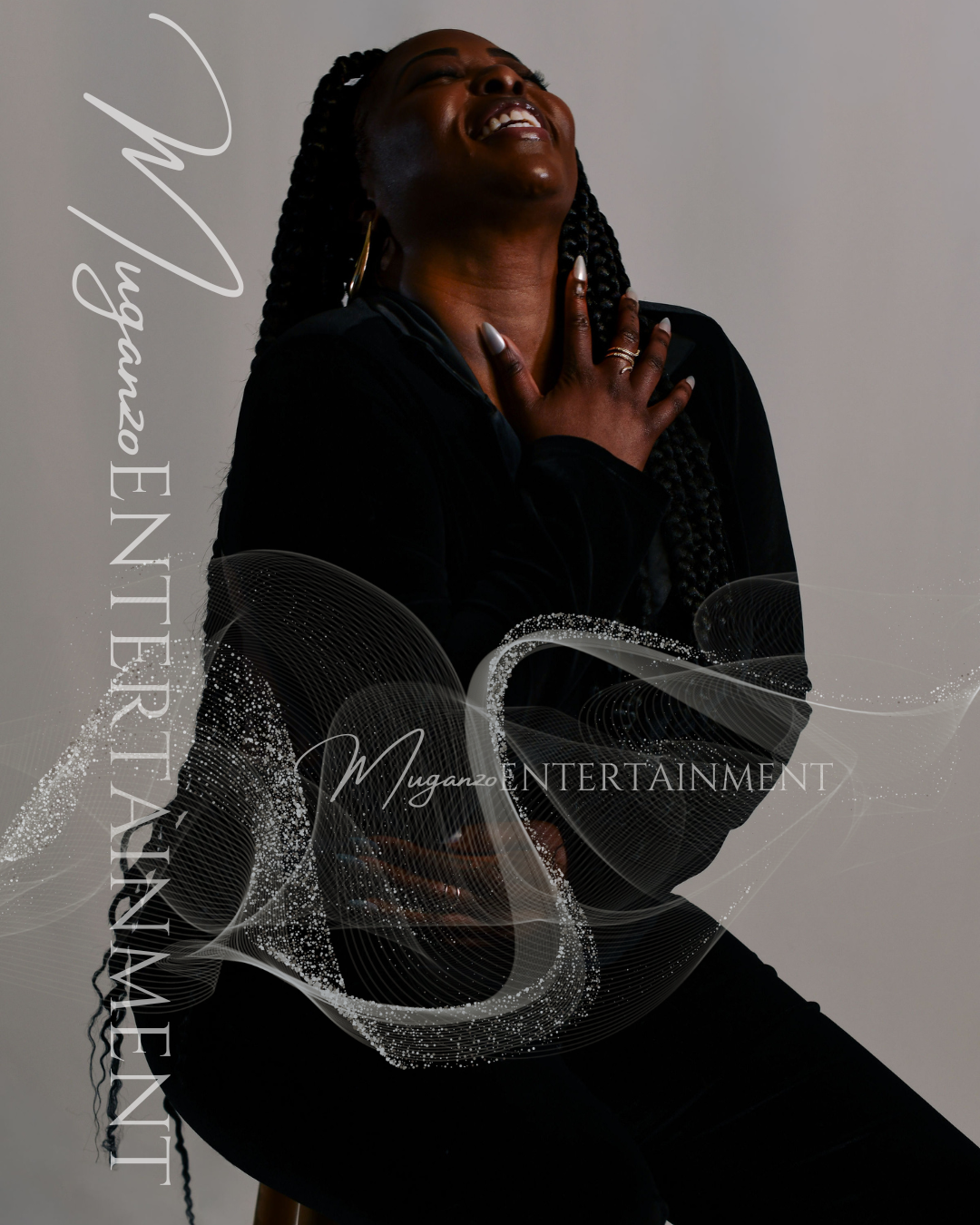 Laughing image of Melissa Muganzo wearing all black