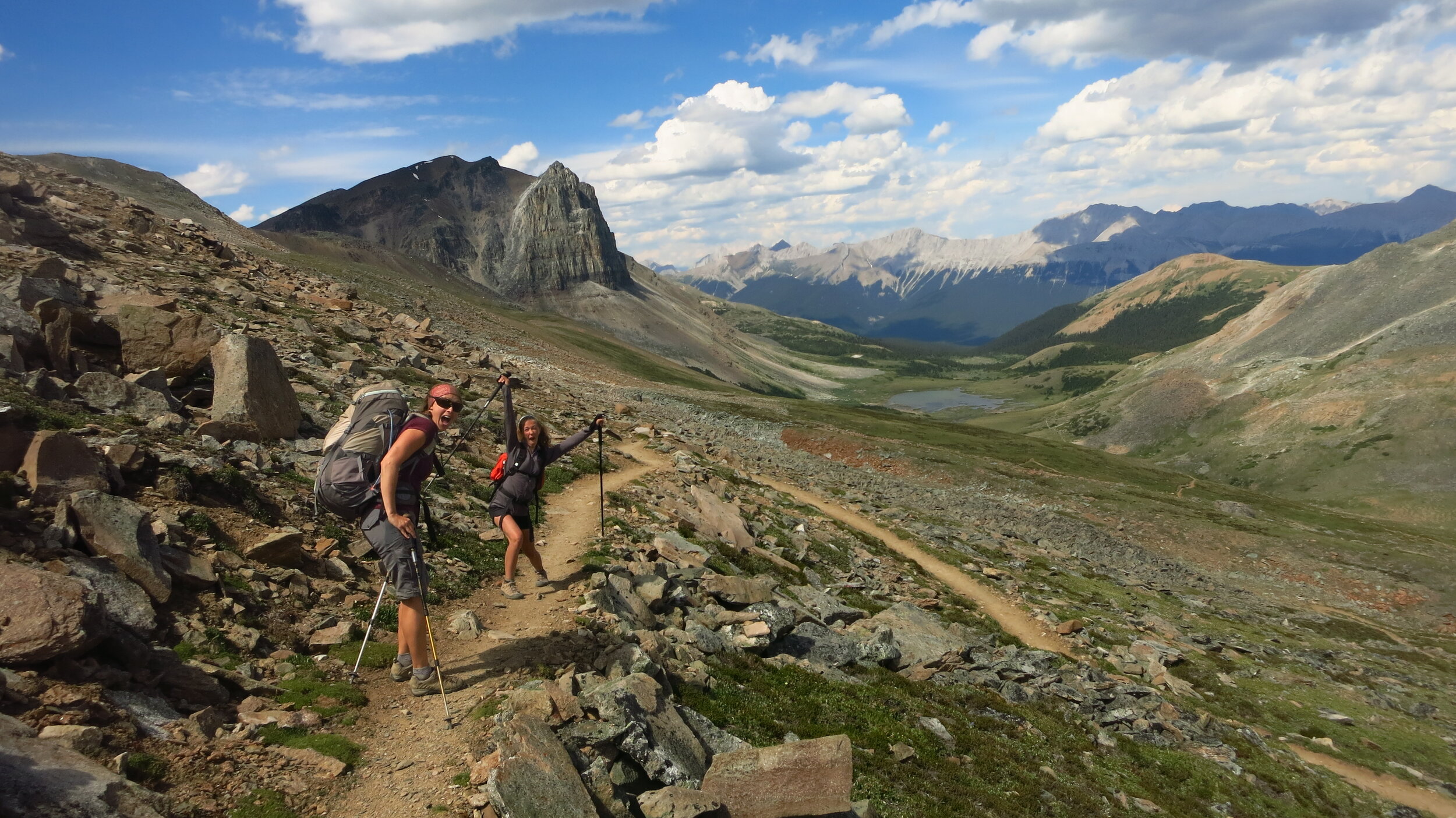 Hikers heading down Amber Mountain switchbacks with Mt. Tekarra in the background, Skyline Trail, Jasper National Park