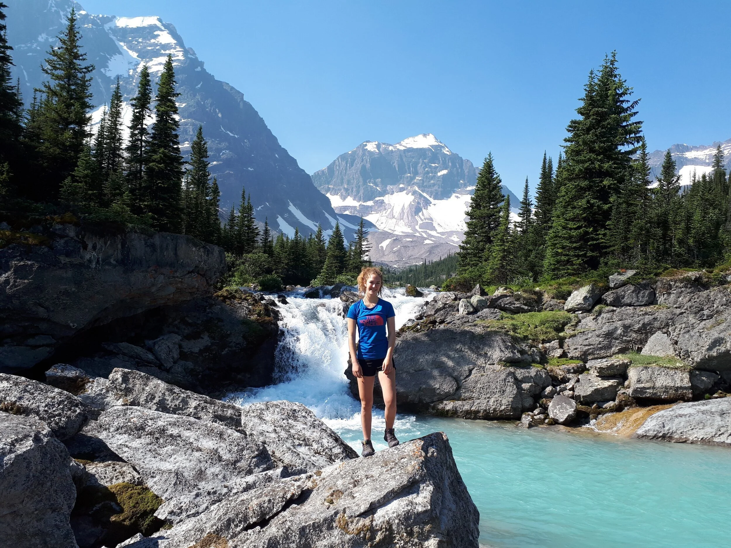 Hiker near the natural pools by the hut, Fryatt Valley, Jasper National Park