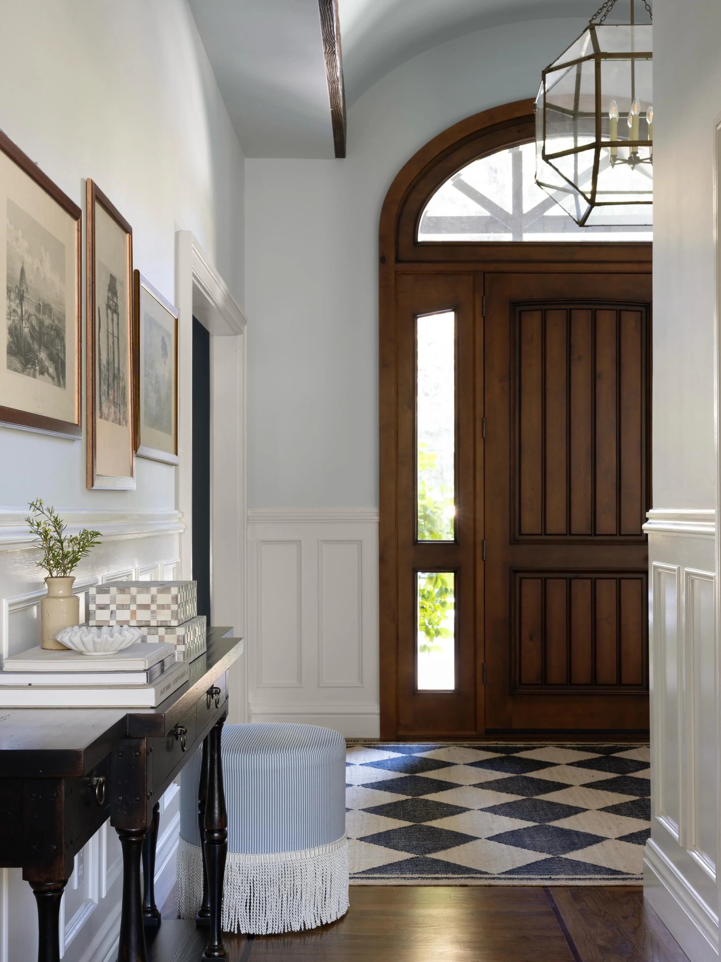 The foyer is the first impression of a home, and before, it wasn&rsquo;t doing enough.
 
With a beautiful barrel ceiling already in place, the goal was to lean into what was working and amplify it. We introduced scale through statement lighting, grou
