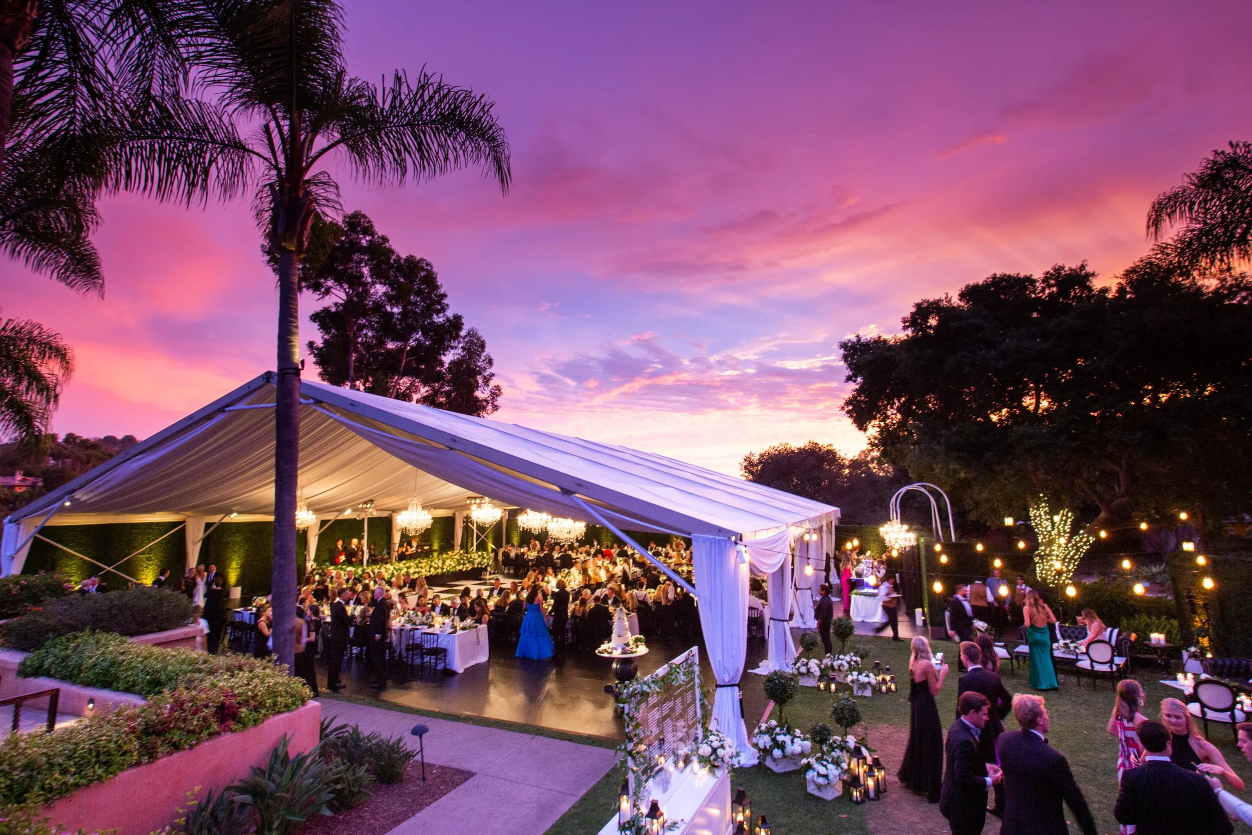 rancho-valencia-wedding-frame-tent-purple-sunset-palm-trees.jpg