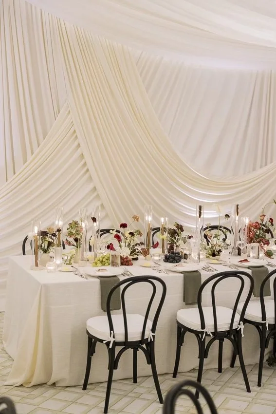 modern-wedding-draping-design-rental-san-diego-ivory-layered-backdrop-black-chairs.jpg
