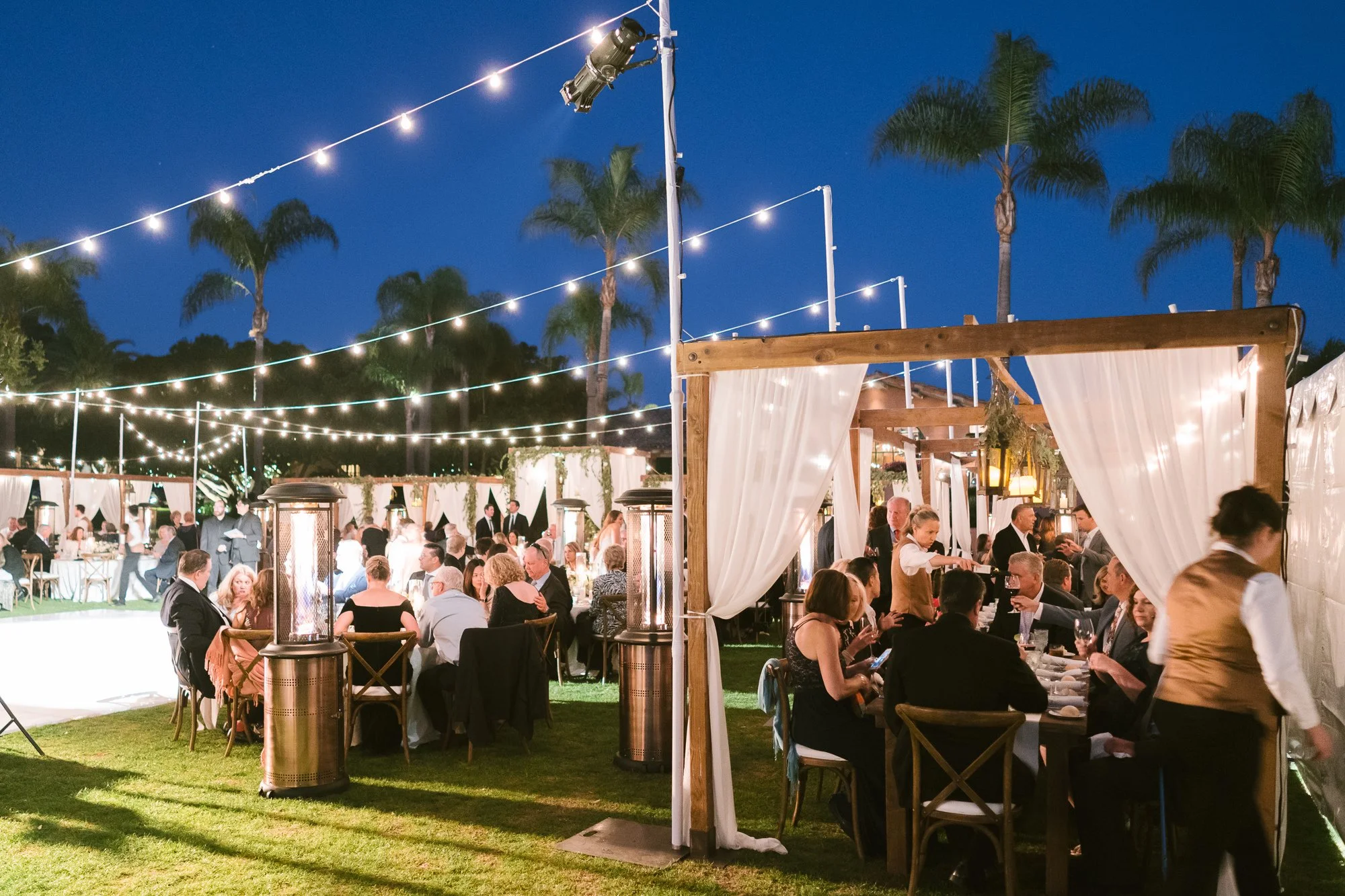 rancho-valencia-wedding-cafe-lights-twilight-palm-trees-patio.jpg