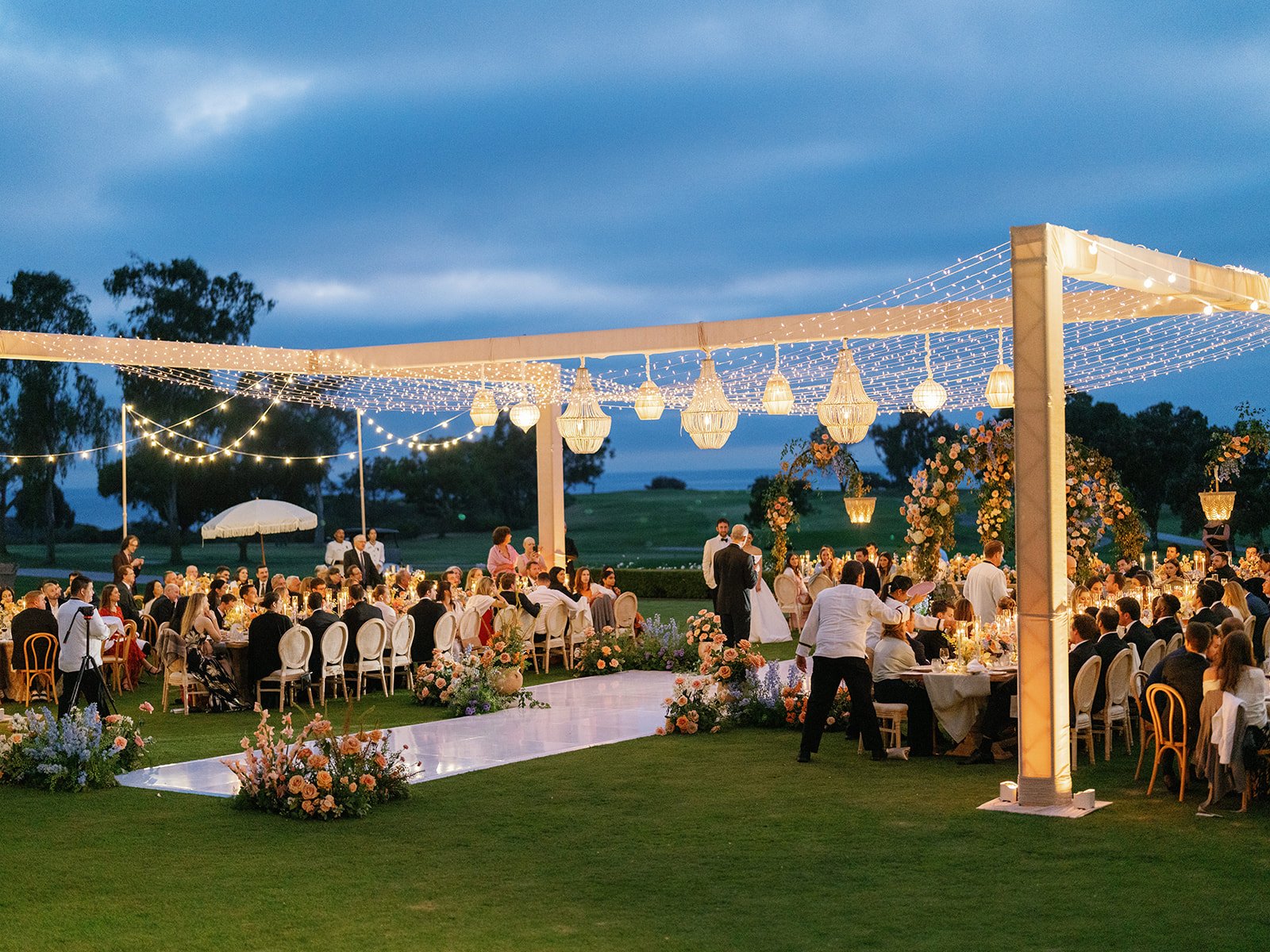 lodge-torrey-pines-wedding-h-truss-beaded-chandeliers-blue-hour-reception.jpg