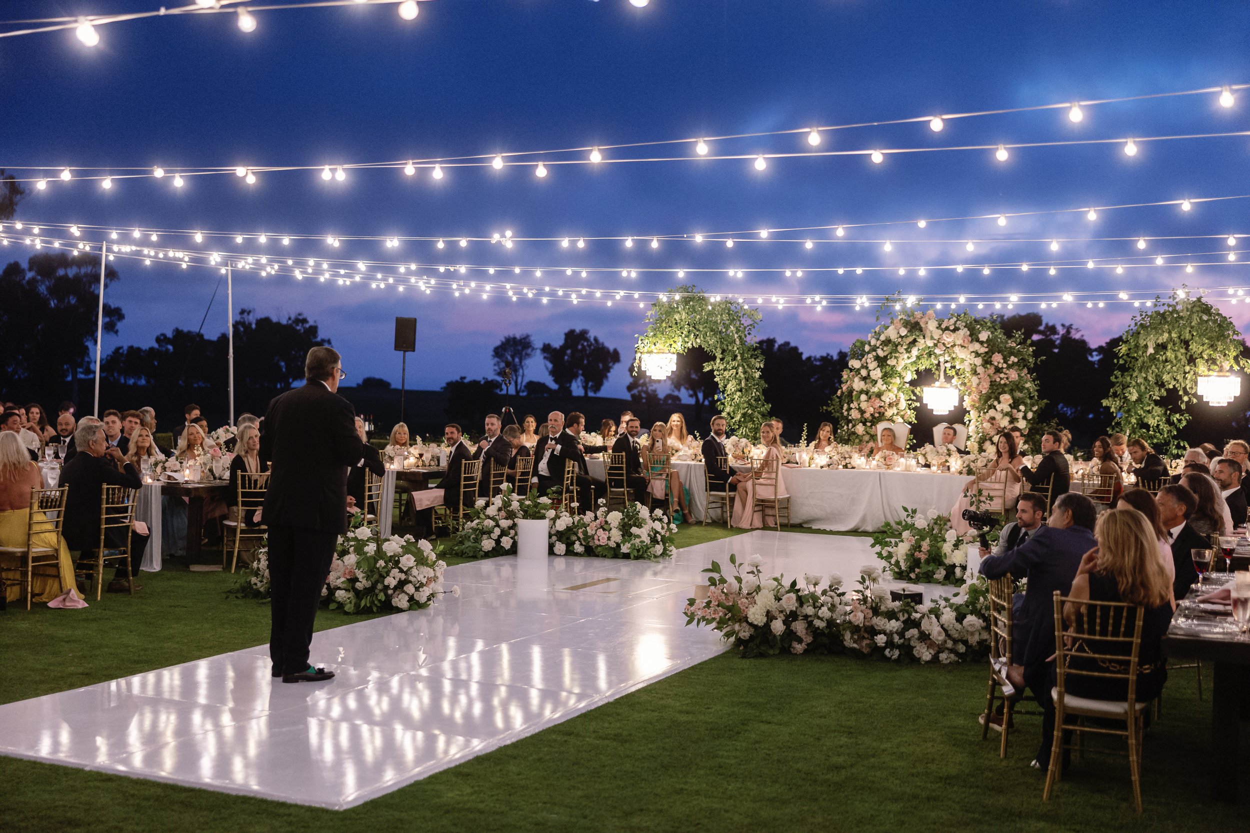 lodge-torrey-pines-wedding-market-lights-canopy-toast-twilight.jpg