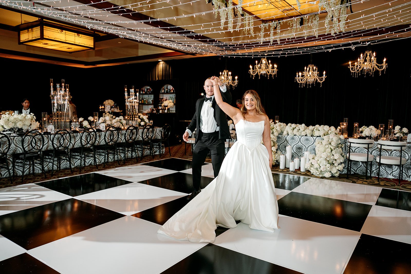 lodge-torrey-pines-wedding-checkerboard-floor-crystal-chandeliers-twinkle-lights.jpg