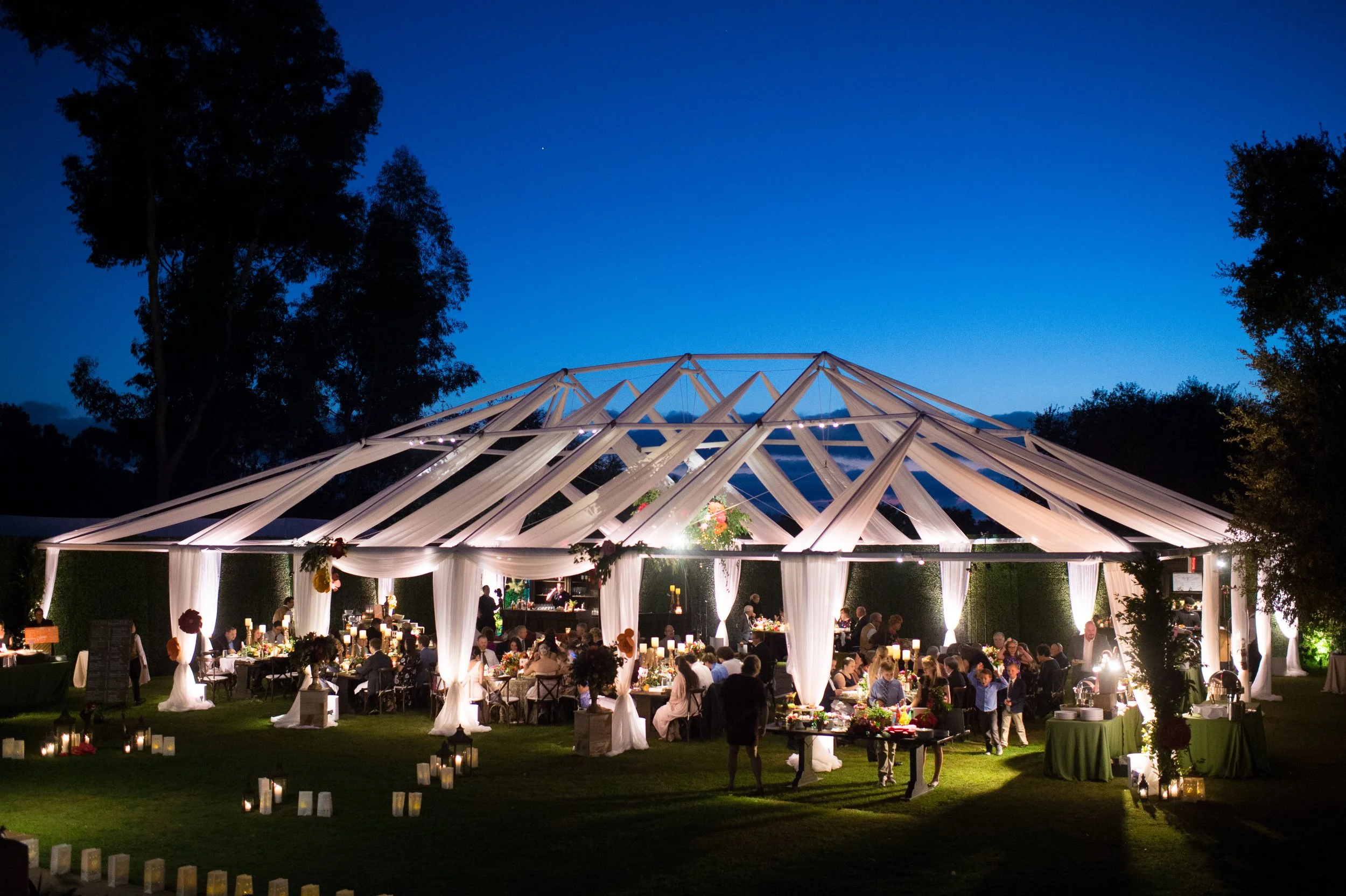 rancho-valencia-wedding-clear-top-tent-blue-hour-candle-path.jpg