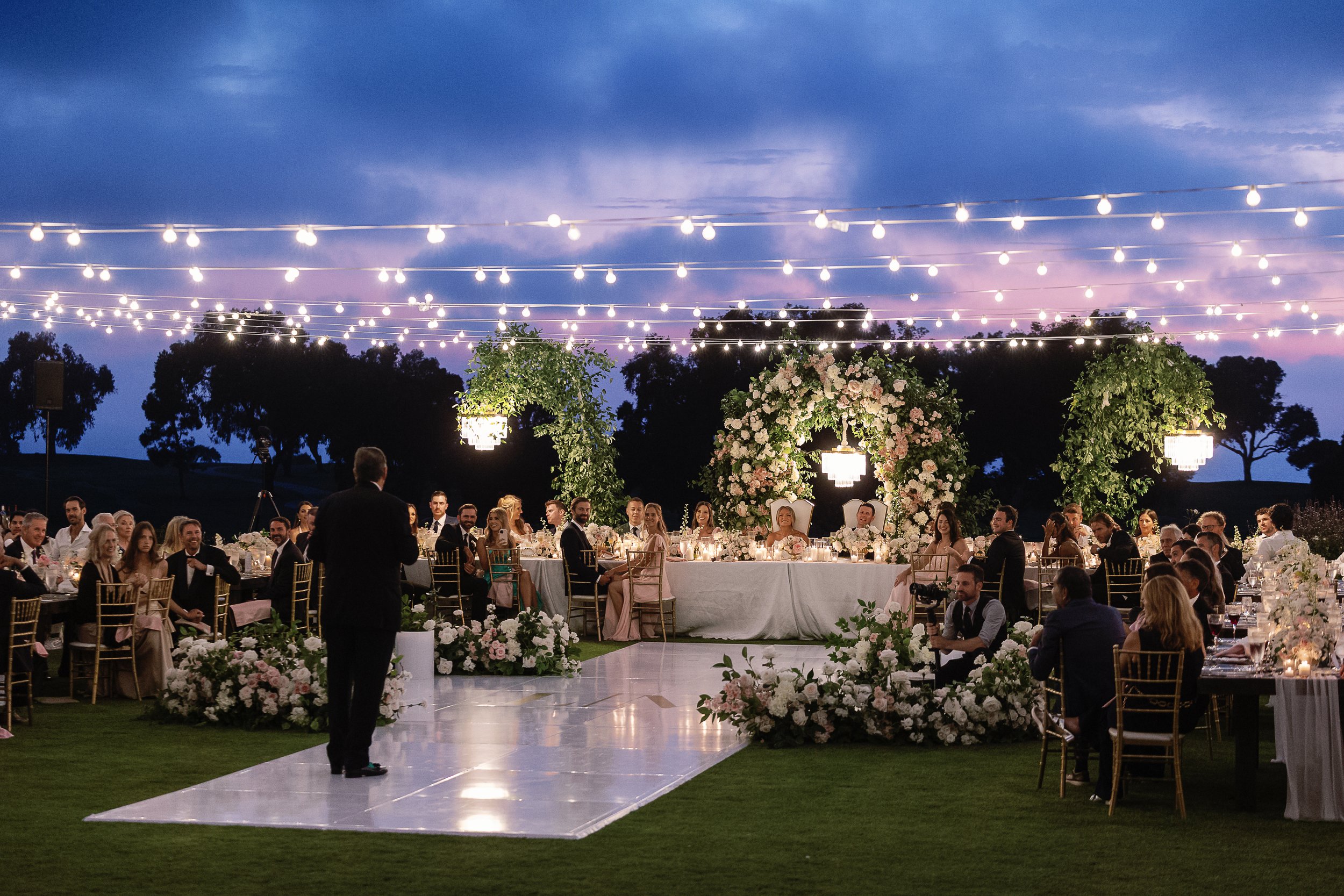 lodge-torrey-pines-wedding-market-lights-floral-arches-twilight-reception.jpg
